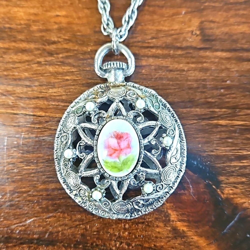 Silver Pendant Necklace with Pink Floral Design